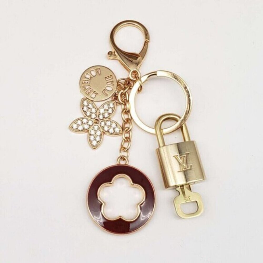 Authentic Louis Vuitton Lock & Key with unbranded Clover Flower Bagcharm 100525